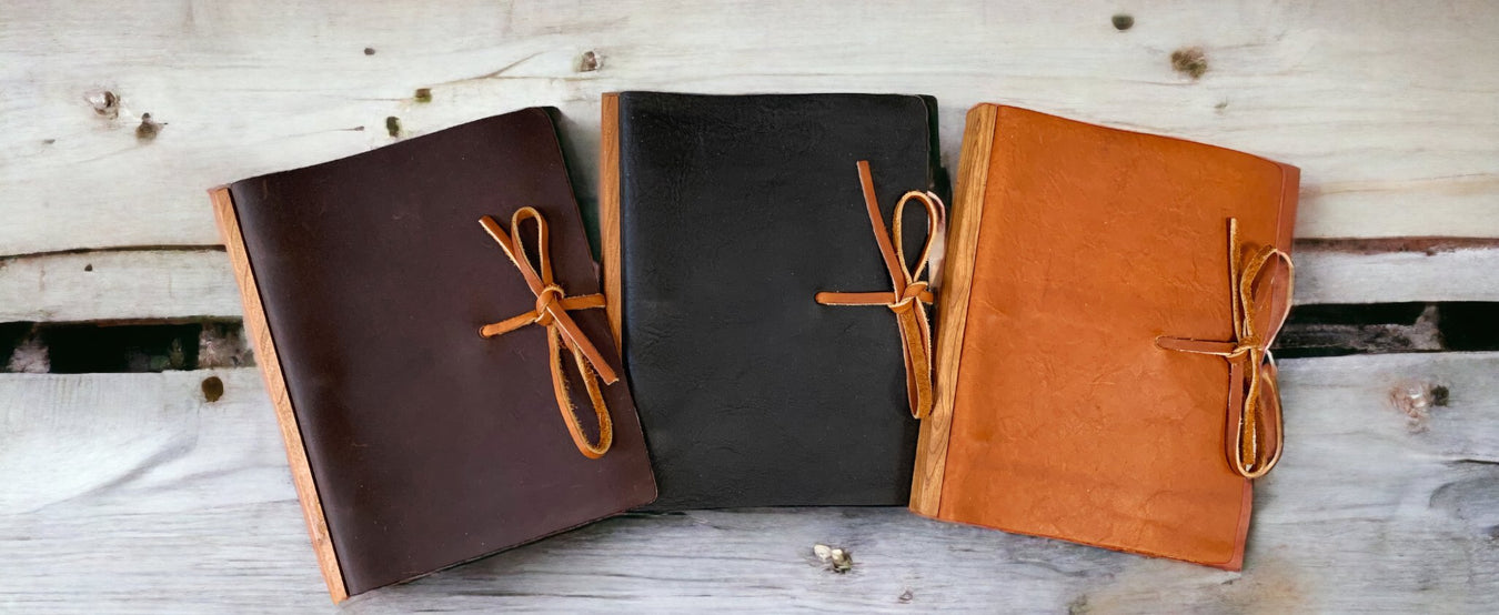 Elegant wooden office gifts, including leather journals, wooden pens and more.