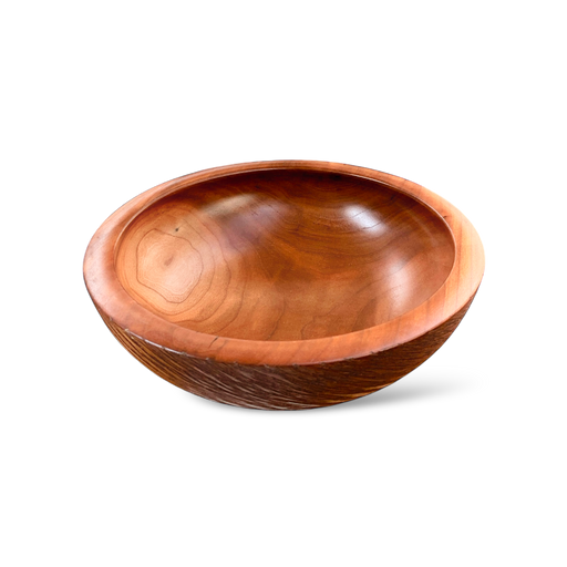 wooden bowl with smooth textured sides made from American cherry.