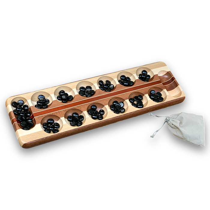 wooden mancala board game with glass stones used as playing pieces. comes with suede pouch and sold at www.barouke.com