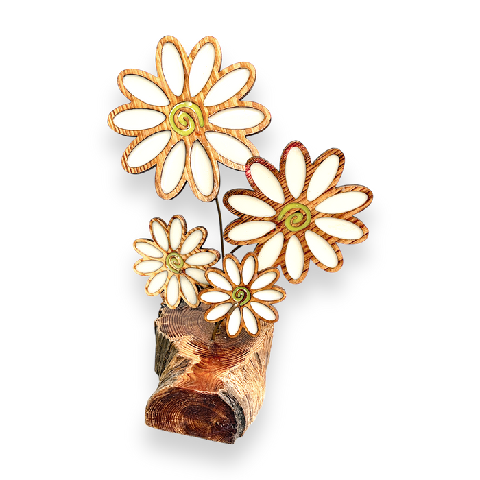 Our sun catcher features four stems of white daisies with copper stems displayed on a rustic wooden base. 